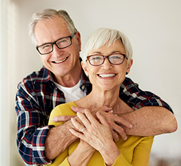 smiling older couple wearing eye glasses